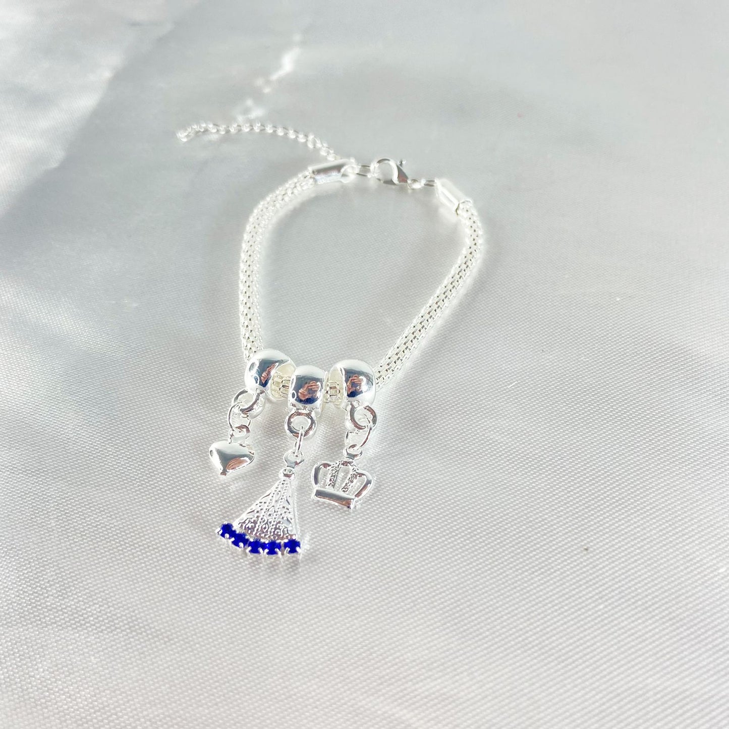 PULSEIRA NÍQUEL NOSSA SENHORA APARECIDA COM STRASS AZUL (6 UNIDADES)