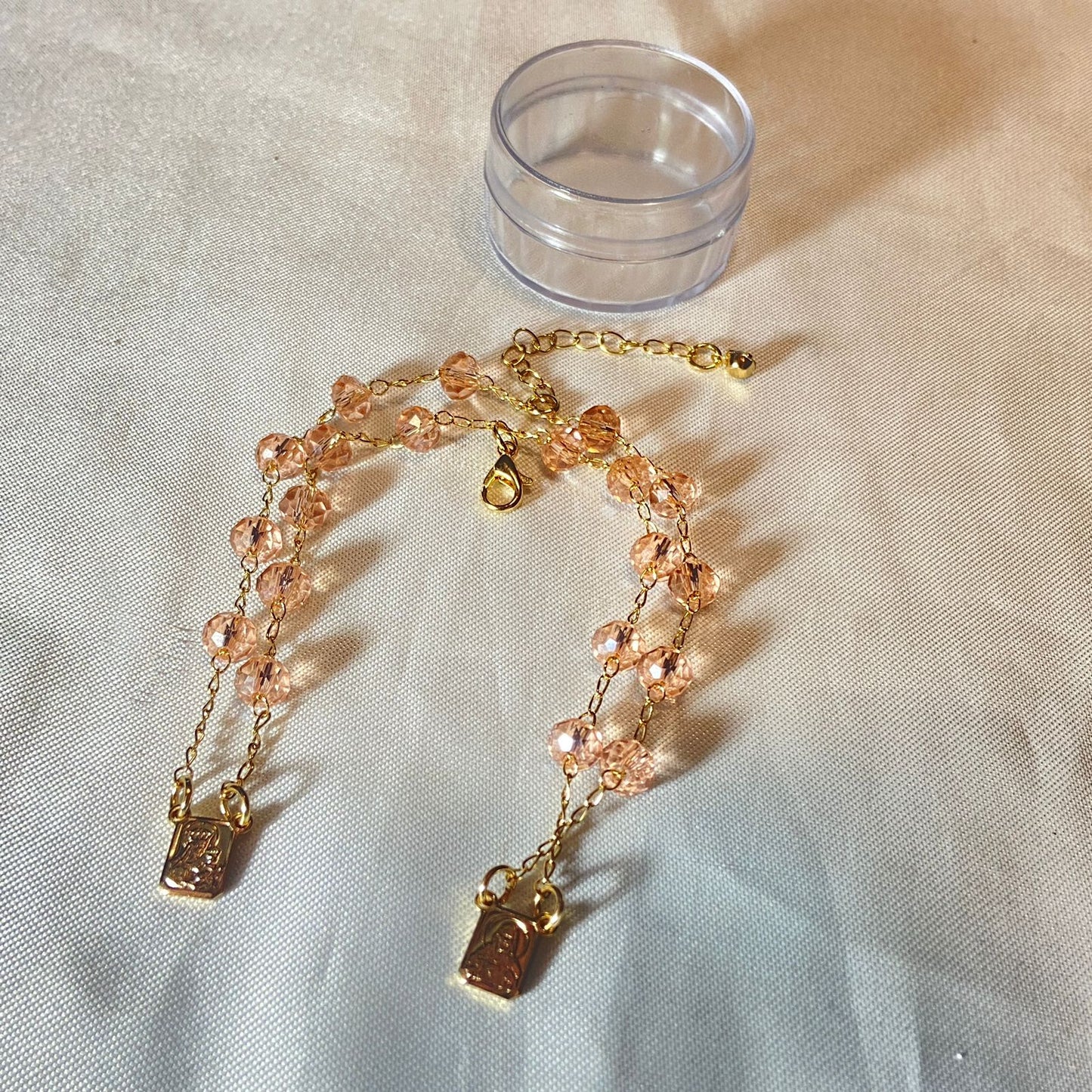 PULSEIRA ESCAPULARIO CRISTAL ROSA TRANSPARENTE (3 UNIDADES)