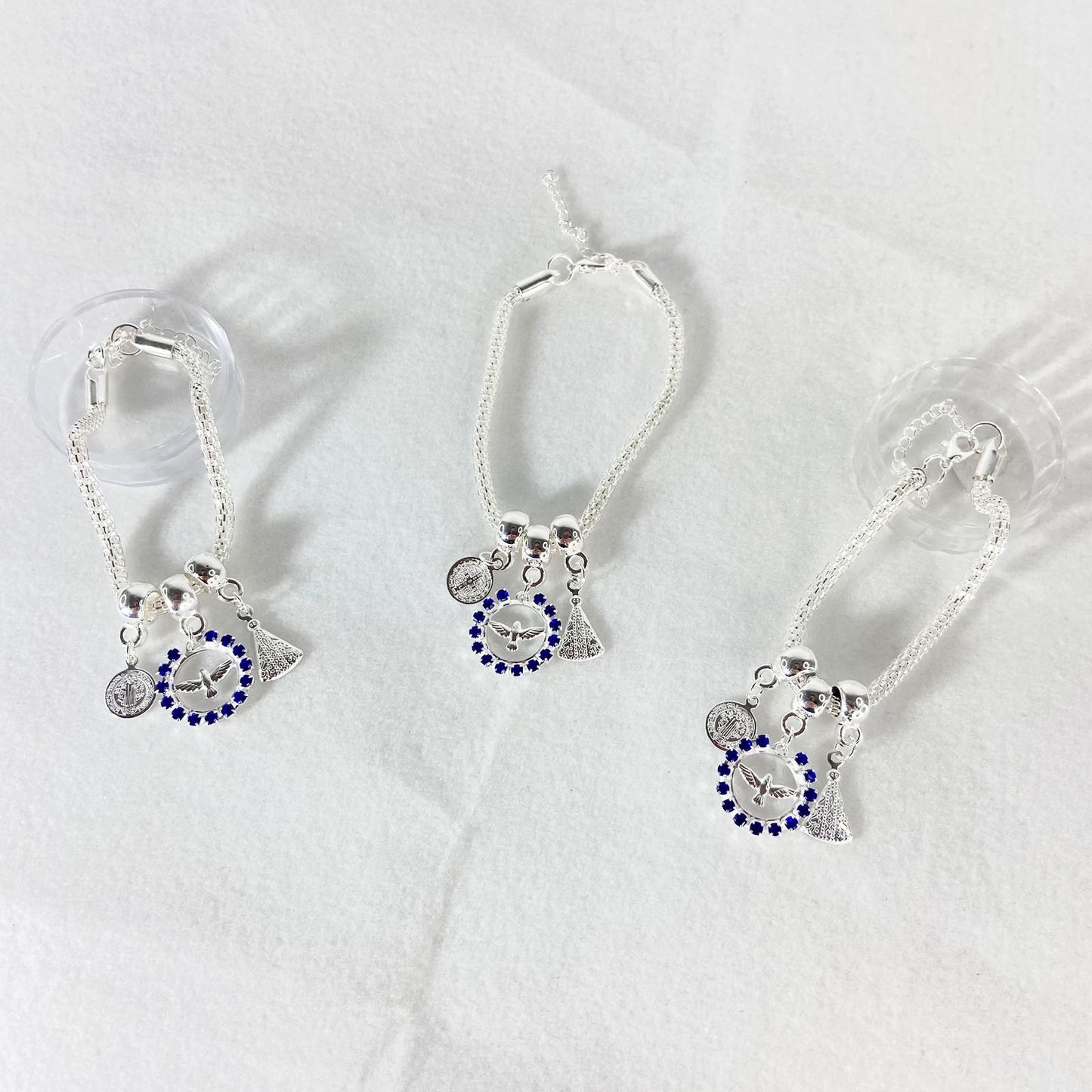 PULSEIRA NÍQUEL DIVINO ESPIRITO SANTO COM STRASS AZUL (6 UNIDADES)