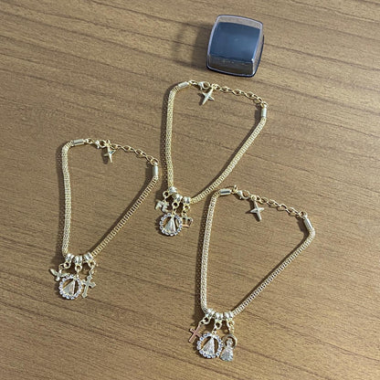 PULSEIRA DOURADA NOSSA SENHORA APARECIDA MODELOS SORTIDOS COM STRASS (6 UNIDADES)