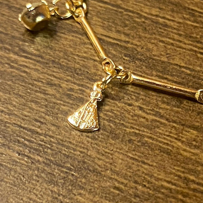 PULSEIRA DOURADA PINGENTES DE NOSSA SENHORA APARECIDA E PONTO DE LUZ  (3 UNIDADES)