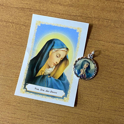MEDALHA NÍQUEL RESINADA NOSSA SENHORA DAS DORES (6 UNIDADE)