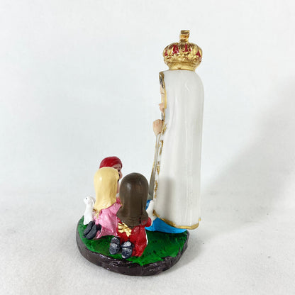 IMAGEM DE RESINA NACIONAL NOSSA SENHORA DE FÁTIMA COM PASTORES INFANTIL 15CM (1 UNIDADE)