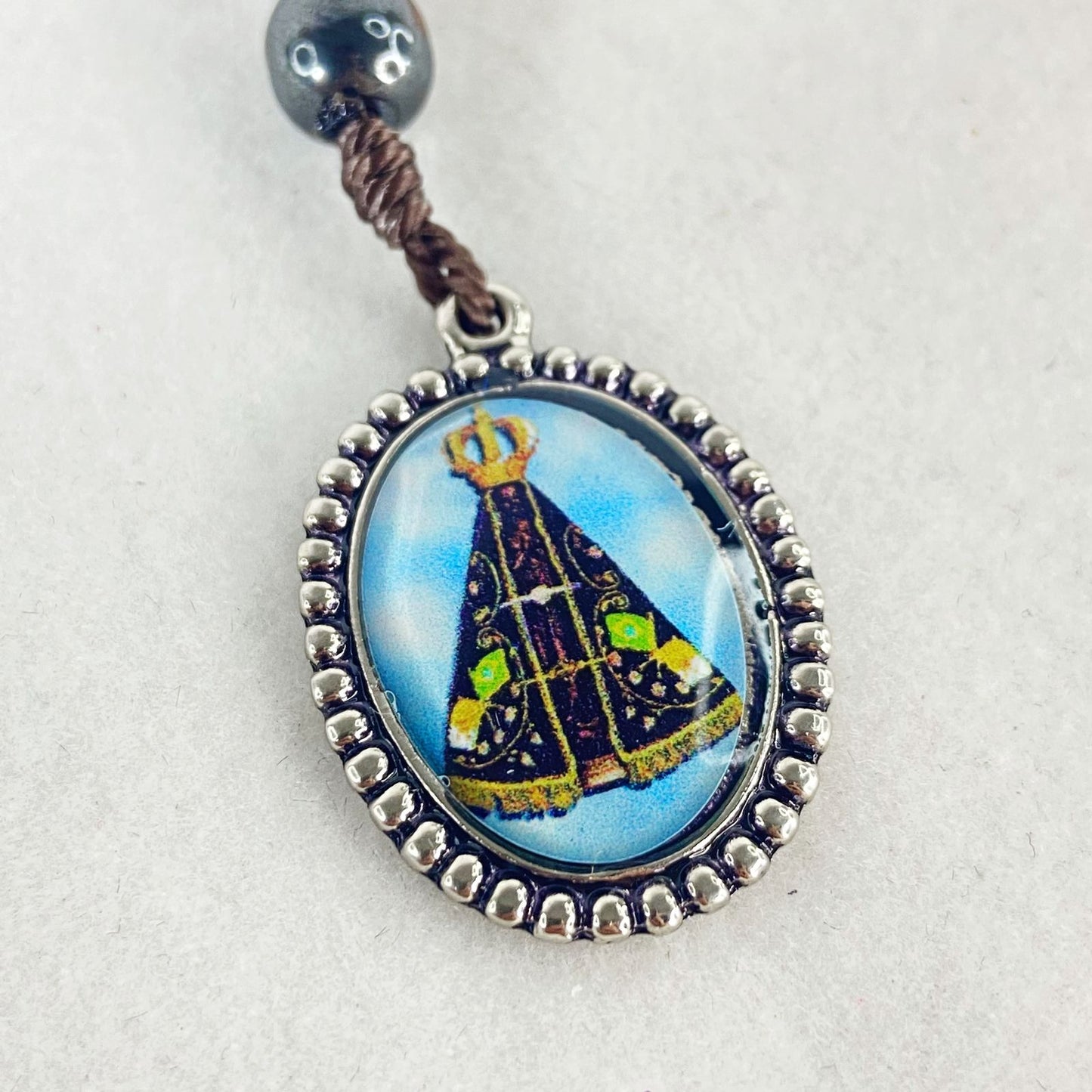 CHAVEIRO DEZENA HEMATITA RESINADO NOSSA SENHORA APARECIDA (3 UNIDADES)