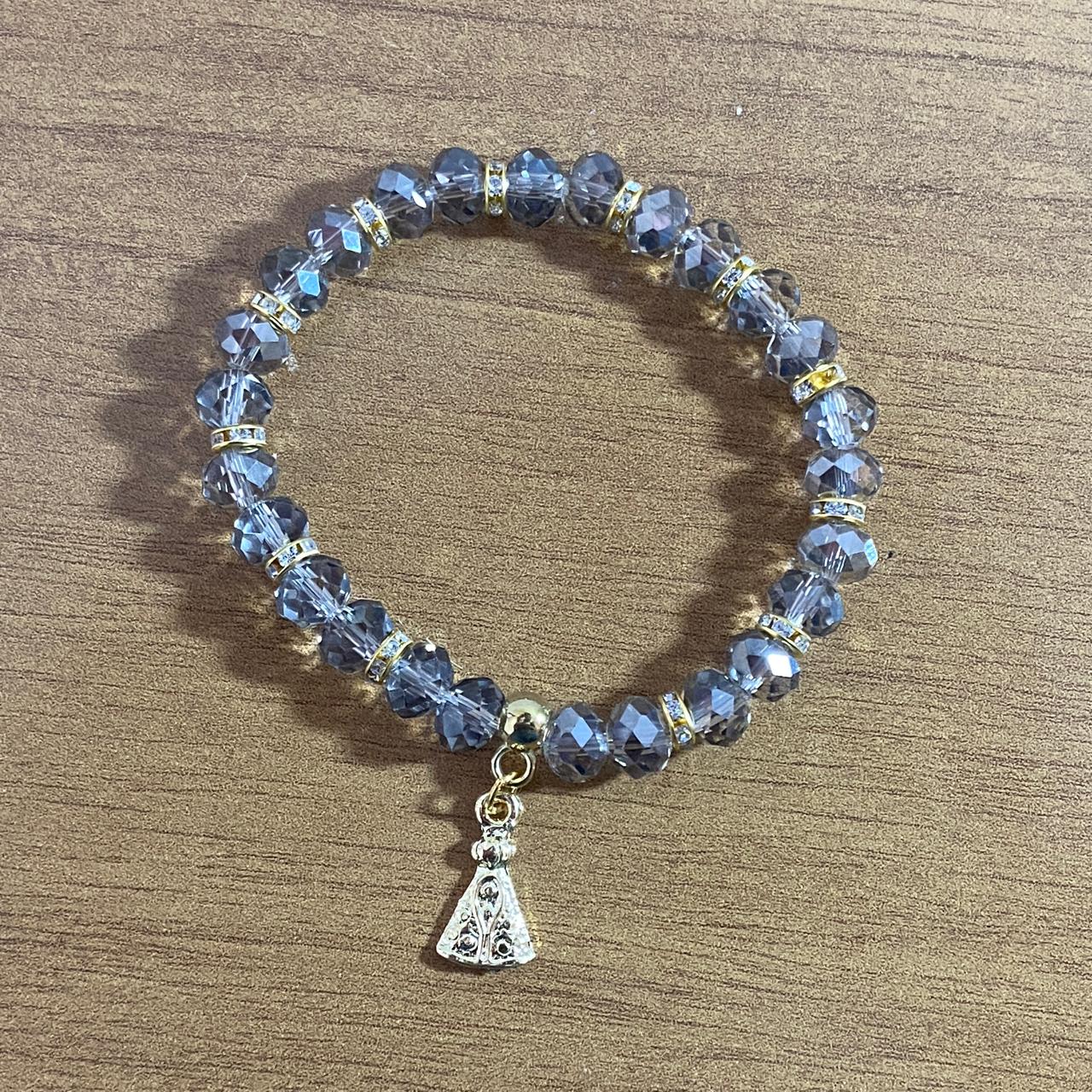 PULSEIRA CRISTAL CINZA TRANSPARENTE NOSSA SENHORA APARECIDA  (06 UNIDADES)