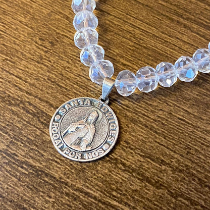 PULSEIRA CRISTAL COM MEDALHA PRATEADA SANTA EDWIGES (01 UNIDADE)