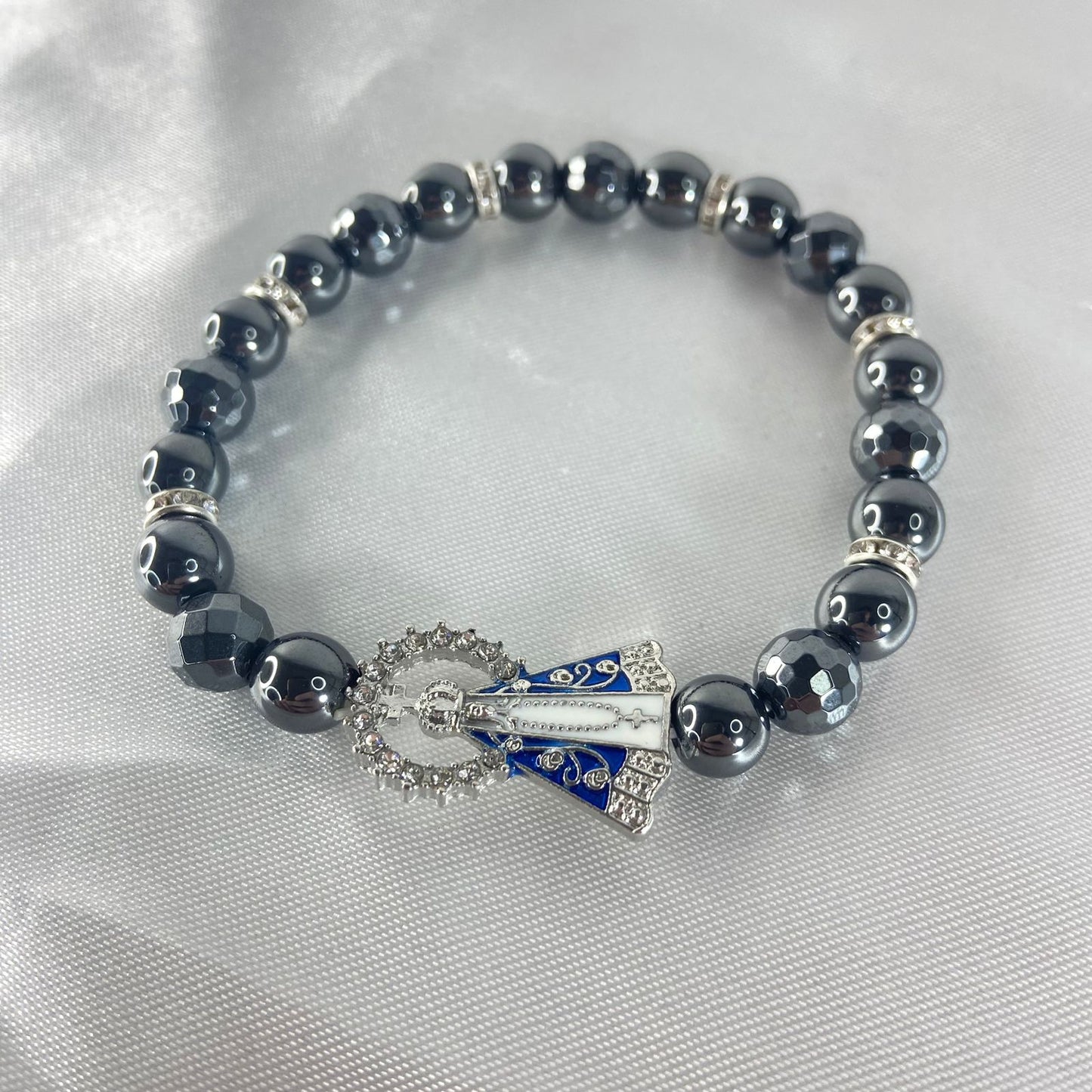 PULSEIRA HEMATITA NOSSA SENHORA APARECIDA COM STRASS (12 UNIDADES)