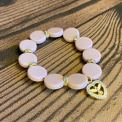 PULSEIRA ACRÍLICA ROSÉ COM MEDALHA DIVINO ESPÍRITO SANTO COM STRASS (03 UNIDADES)