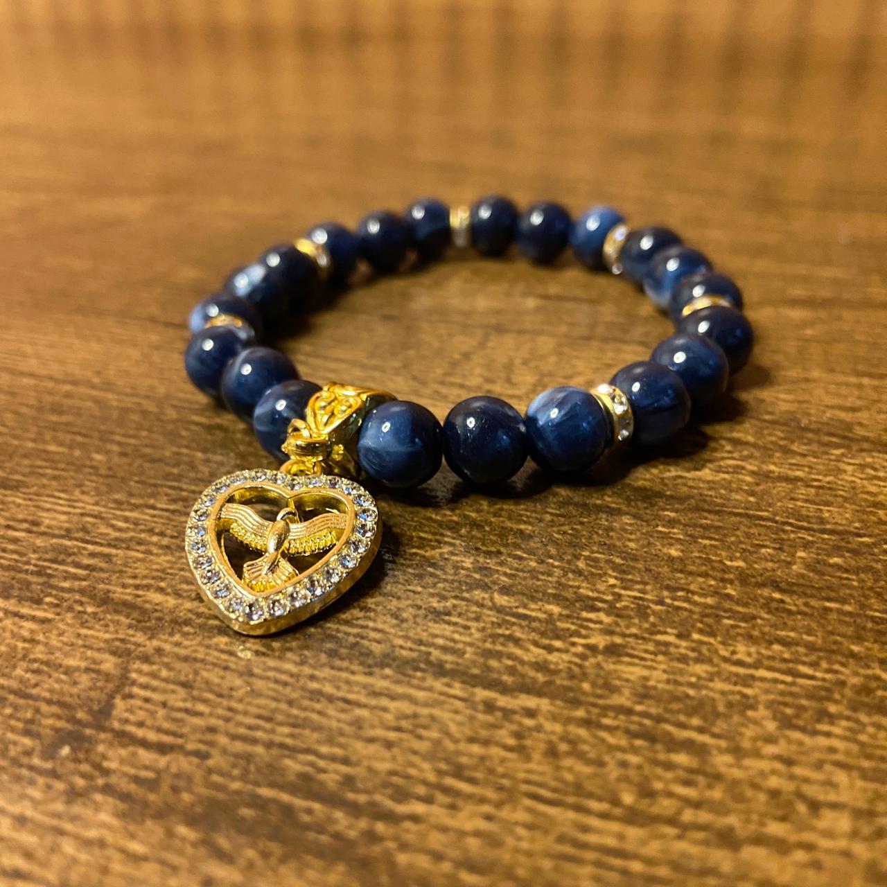PULSEIRA PÉROLA AZUL COM PINGENTE DIVINO ESPÍRITO SANTO COM STRASS 08MM  (03 UNIDADES)