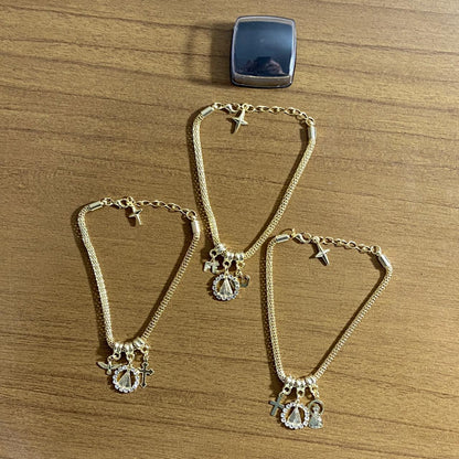 PULSEIRA DOURADA NOSSA SENHORA APARECIDA MODELOS SORTIDOS COM STRASS (6 UNIDADES)