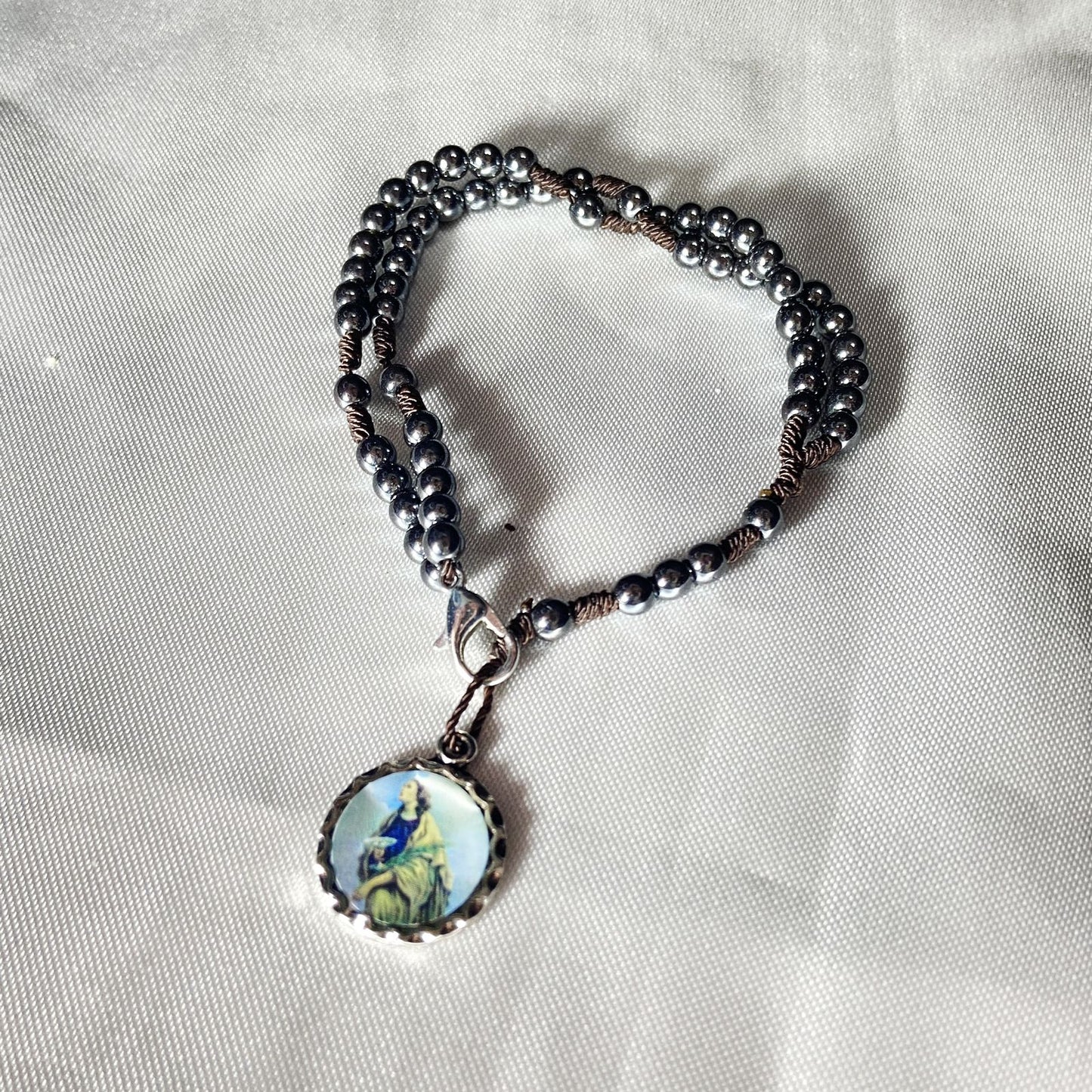 TERÇO PULSEIRA HEMATITA SANTA LUZIA 4MM (6 UNIDADES)