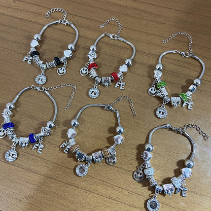 PULSEIRA PRATEADA FÉ COM BERLOQUES  (6 UNIDADES)