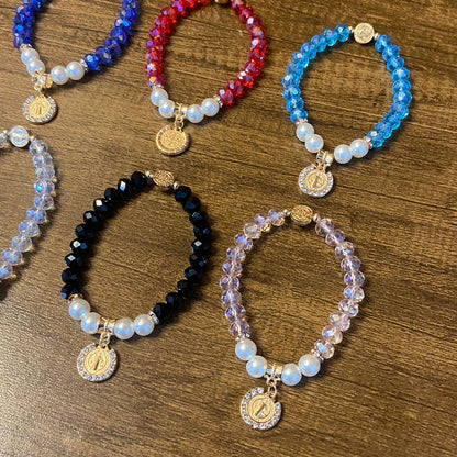 PULSEIRA CRISTAL COM PÉROLA MEDALHA SÃO BENTO CORES SORTIDAS  ( 06 UNIDADES