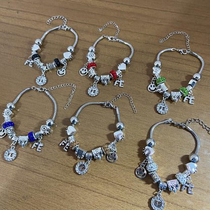 PULSEIRA PRATEADA FÉ COM BERLOQUES  (6 UNIDADES)