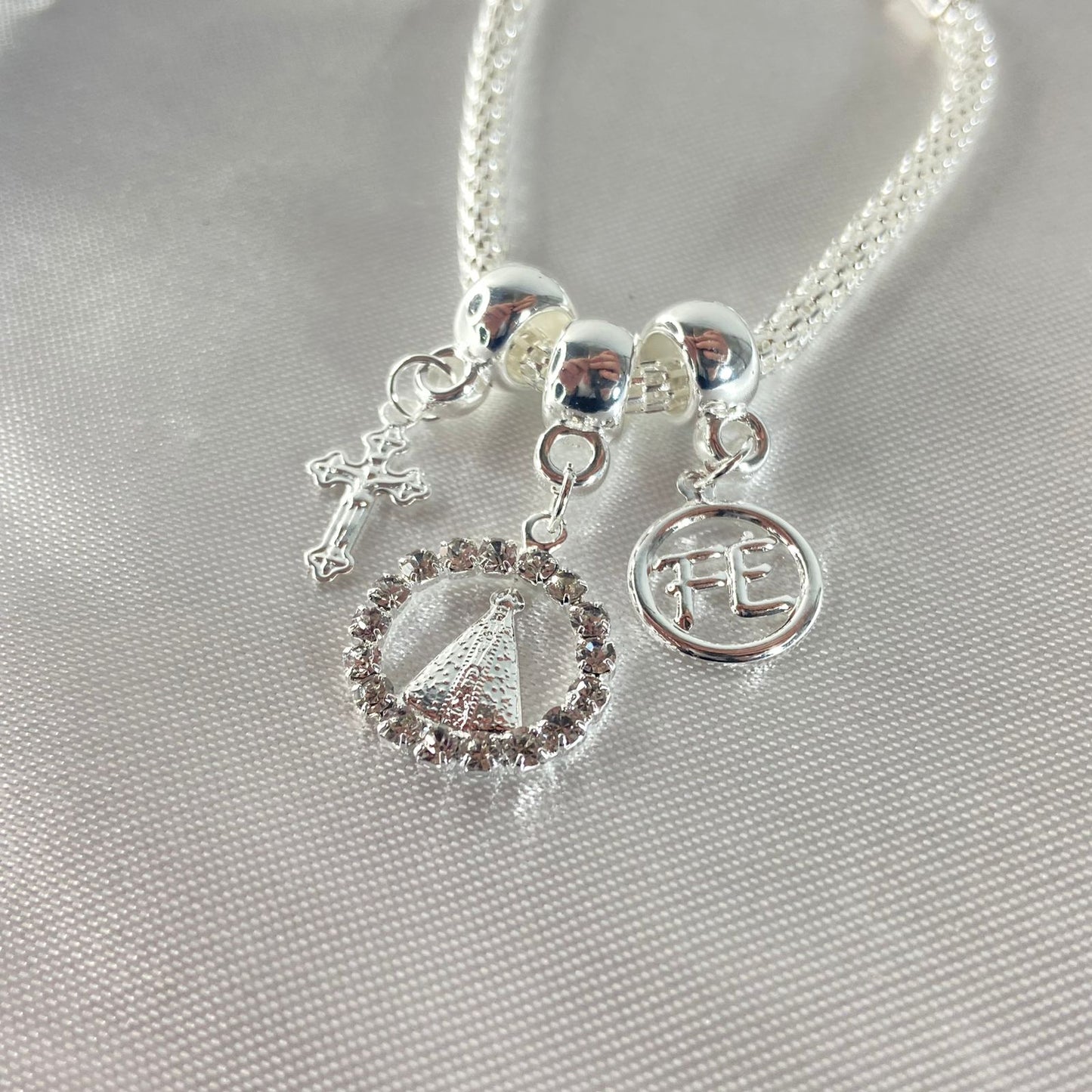 PULSEIRA NÍQUEL REDONDO NOSSA SENHORA APARECIDA COM STRASS BRANCO (6 UNIDADES)
