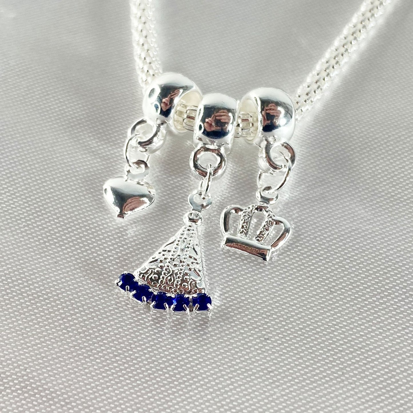 PULSEIRA NÍQUEL NOSSA SENHORA APARECIDA COM STRASS AZUL (6 UNIDADES)