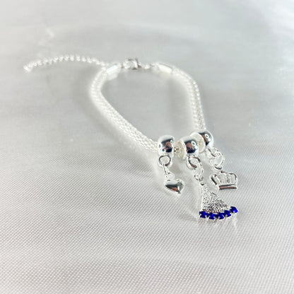 PULSEIRA NÍQUEL NOSSA SENHORA APARECIDA COM STRASS AZUL (6 UNIDADES)