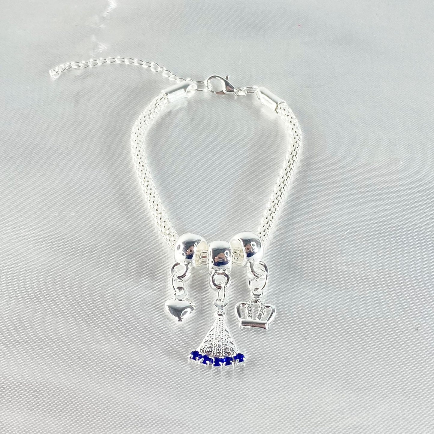 PULSEIRA NÍQUEL NOSSA SENHORA APARECIDA COM STRASS AZUL (6 UNIDADES)