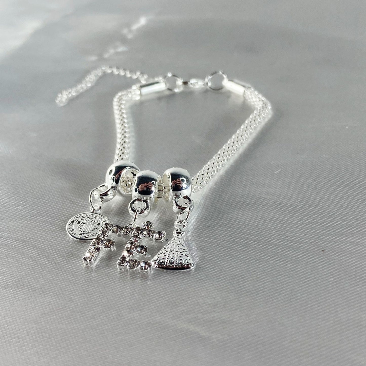 PULSEIRA NÍQUEL FÉ COM STRASS BRANCO (6 UNIDADES)