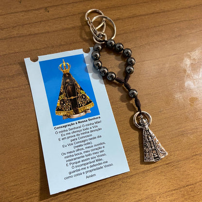 CHAVEIRO DEZENA HEMATITA COM MOSQUETE NOSSA SENHORA APARECIDA (3 UNIDADES)