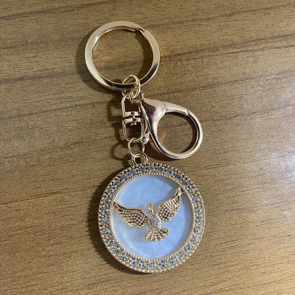 CHAVEIRO LUXO DIVINO ESPIRITO SANTO MADREPÉROLA COM STRASS (6 UNIDADES)