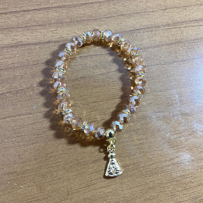 PULSEIRA CRISTAL BEGE TRANSPARENTE NOSSA SENHORA APARECIDA  (06 UNIDADES)