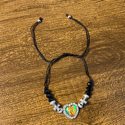 PULSEIRA REGULÁVEL CRISTAL PRETO COM MEDALHA RESINADA NOSSA SENHORA DE GUADALUPE  ( 01 UNIDADE)