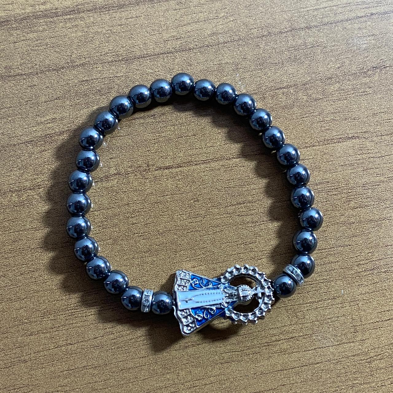 PULSEIRA HEMATITA NOSSA SENHORA APARECIDA COM STRASS (6 UNIDADES)