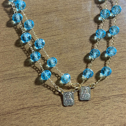 PULSEIRA ESCAPULARIO CRISTAL AZUL CLARO (3 UNIDADES)