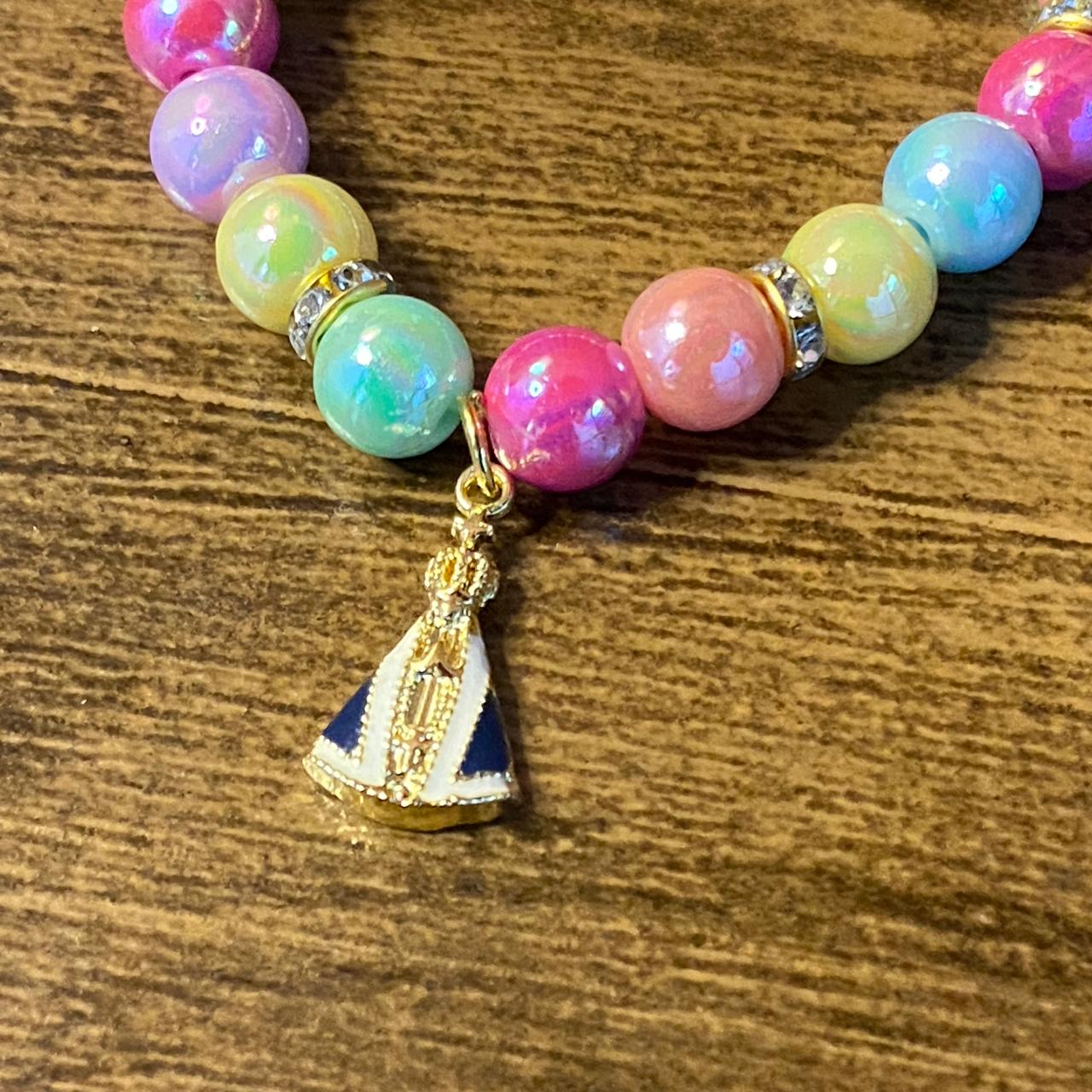 PULSEIRA PÉROLA INFANTIL COM PNGENTE NOSSA SENHORA APARECIDA  (03 UNIDADES)