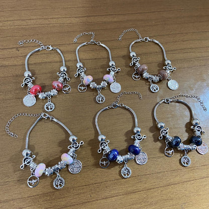 PULSEIRA PRATEADA MEDALHA SÃO BENTO COM BERLOQUES  (6 UNIDADES)