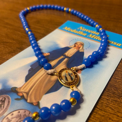 TERÇO PÉROLA AZUL NOSSA SENHORA DAS GRAÇAS 6MM (1 UNIDADE)