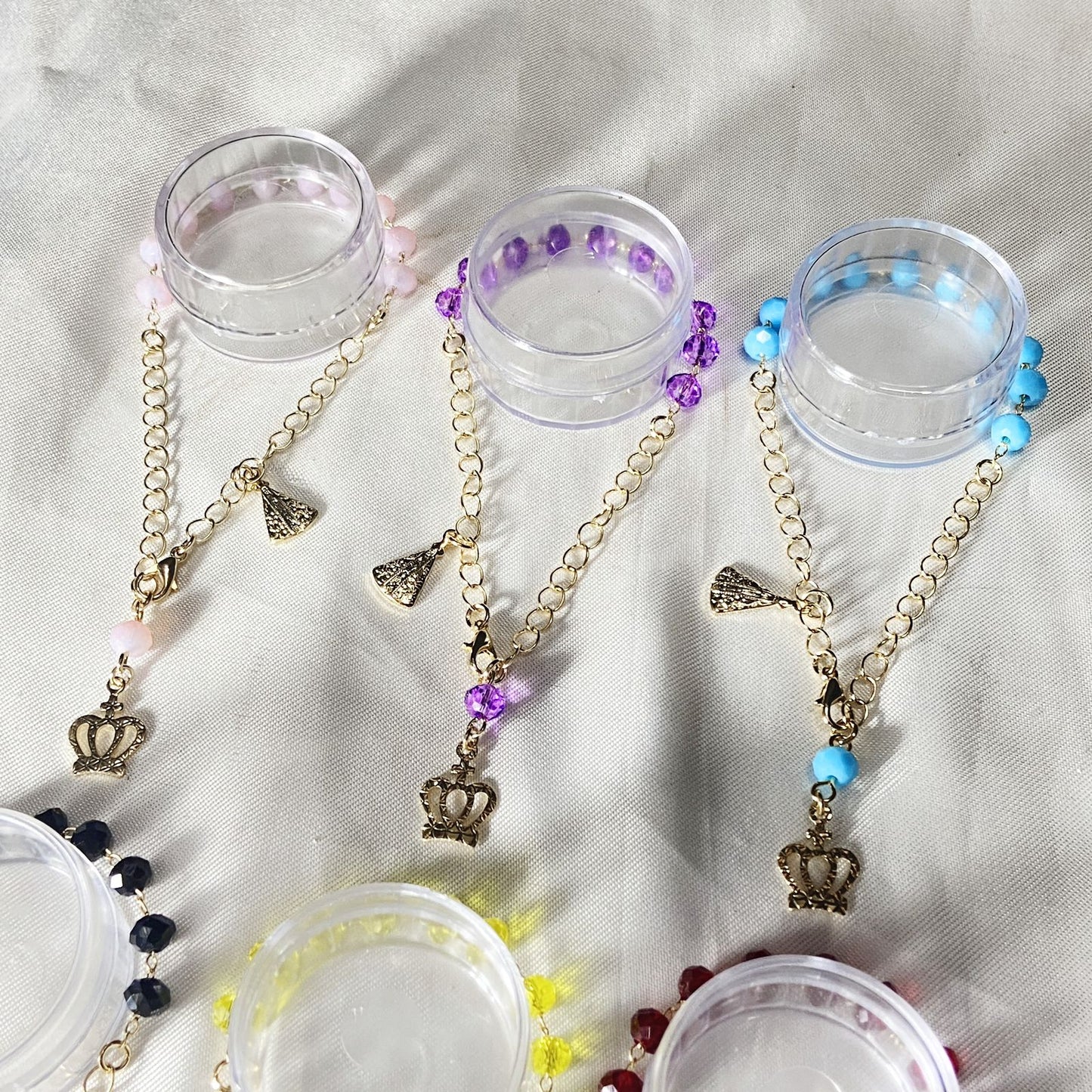 PULSEIRA DOURADA CRISTAL NOSSA SENHORA APARECIDA CORES SORTIDAS  (6 UNIDADES)