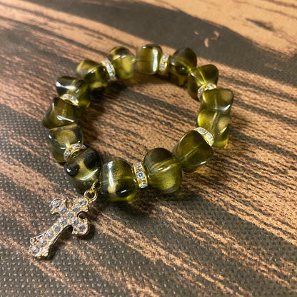 PULSEIRA PÉROLA MARROM EDOURADA COM PINGENTE DE CRUZ 10MM  (03 UNIDADES)