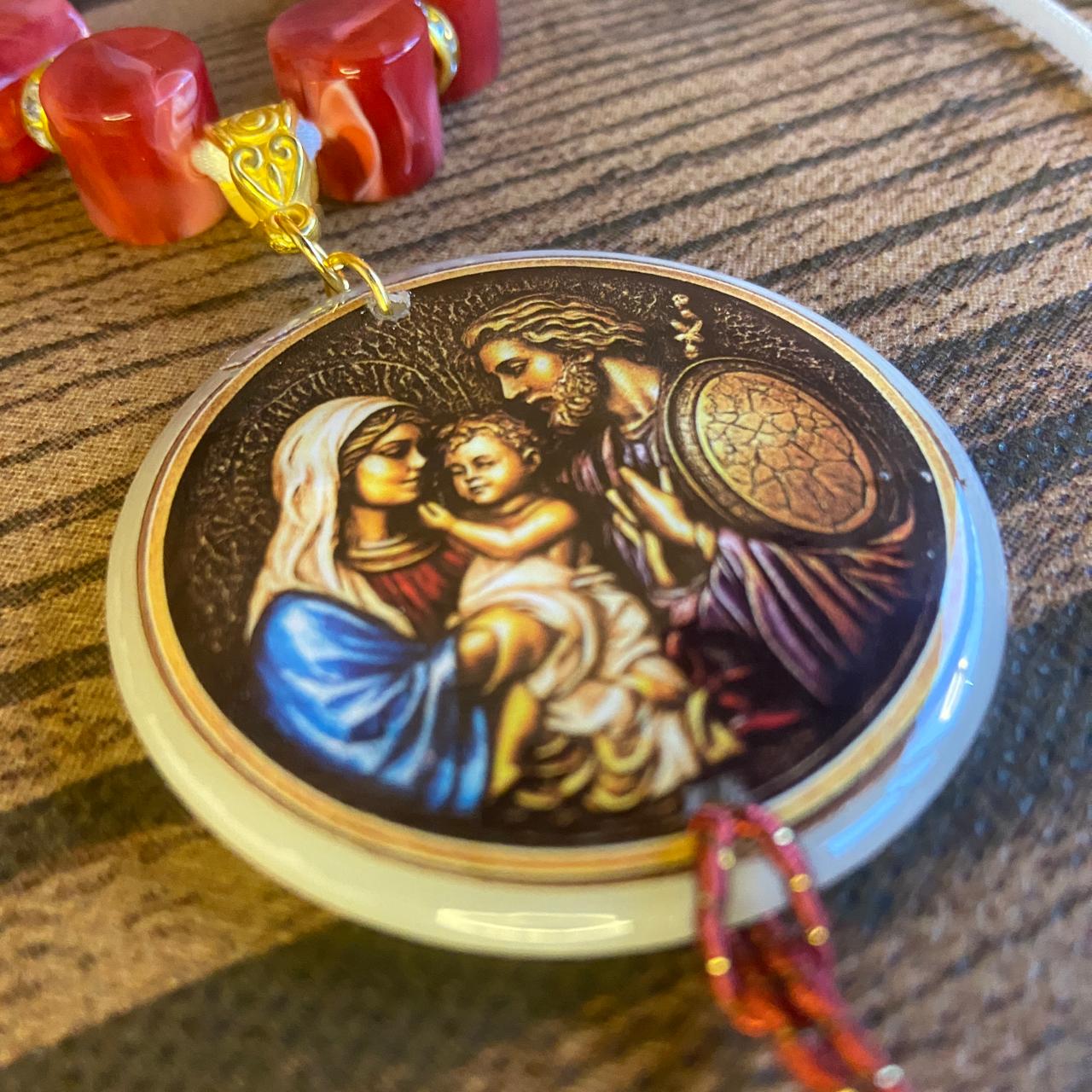 DEZENA PEDRARIAS MEDALHÃO RESINADO SAGRADA FAMÍLIA  12MM  (1 UNIDADE)