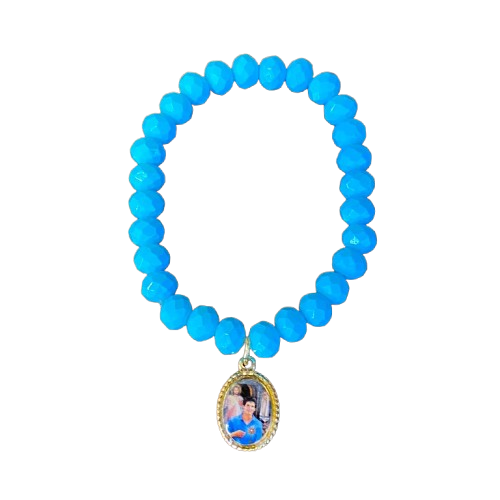 PULSEIRA CRISTAL AZUL COM MEDALHA RESINADA SÃO CARLO ACUTIS (01 UNIDADE)