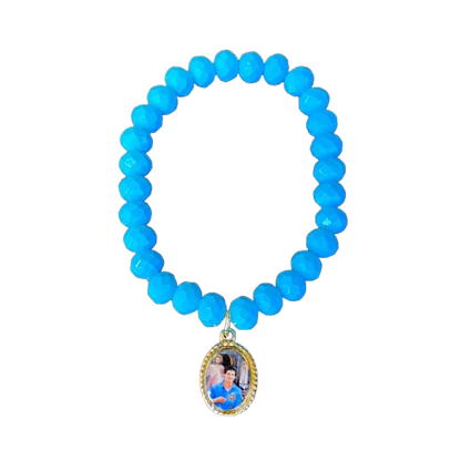 PULSEIRA CRISTAL AZUL COM MEDALHA RESINADA SÃO CARLO ACUTIS (01 UNIDADE)