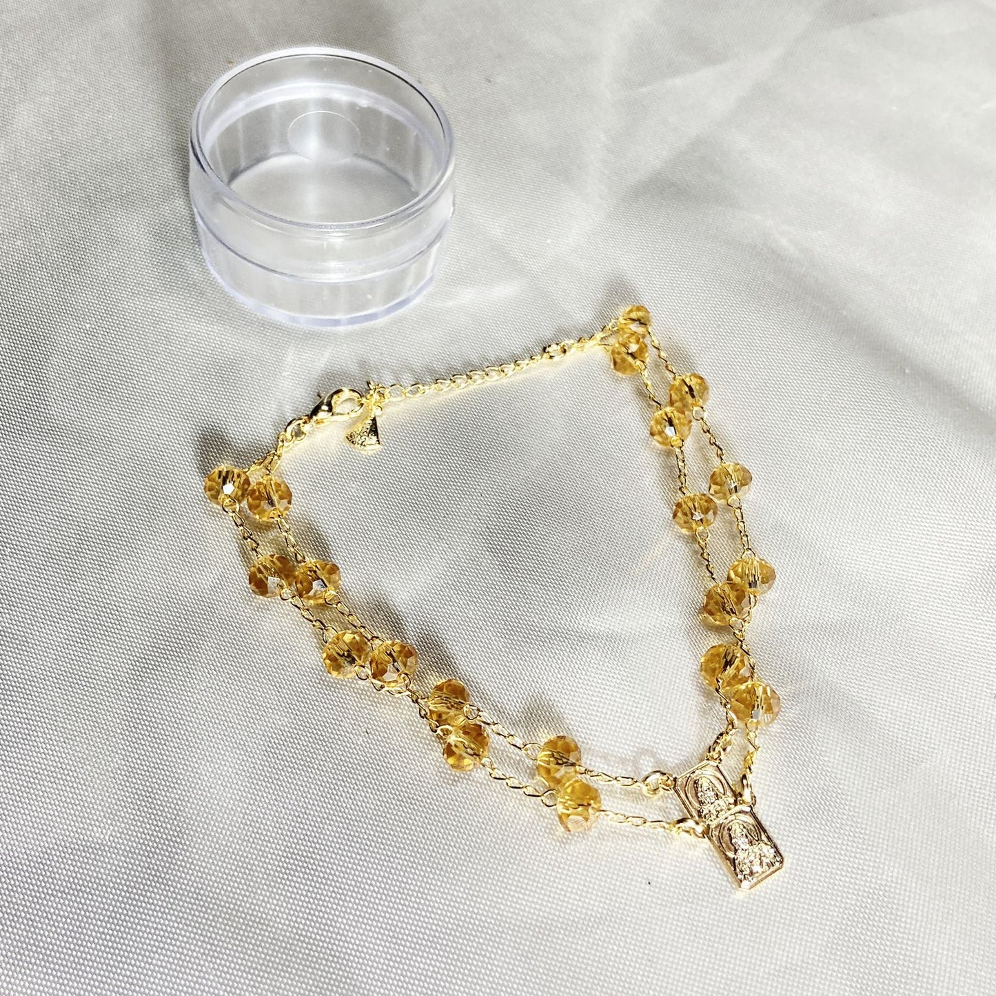 PULSEIRA ESCAPULARIO CRISTAL BEGE TRANSPARENTE (3 UNIDADES)
