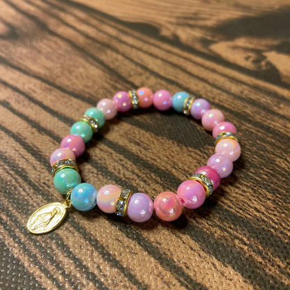 PULSEIRA PÉROLA INFANTIL COM PINGENTE NOSSA SENHORA DAS GRAÇAS (03 UNIDADES)