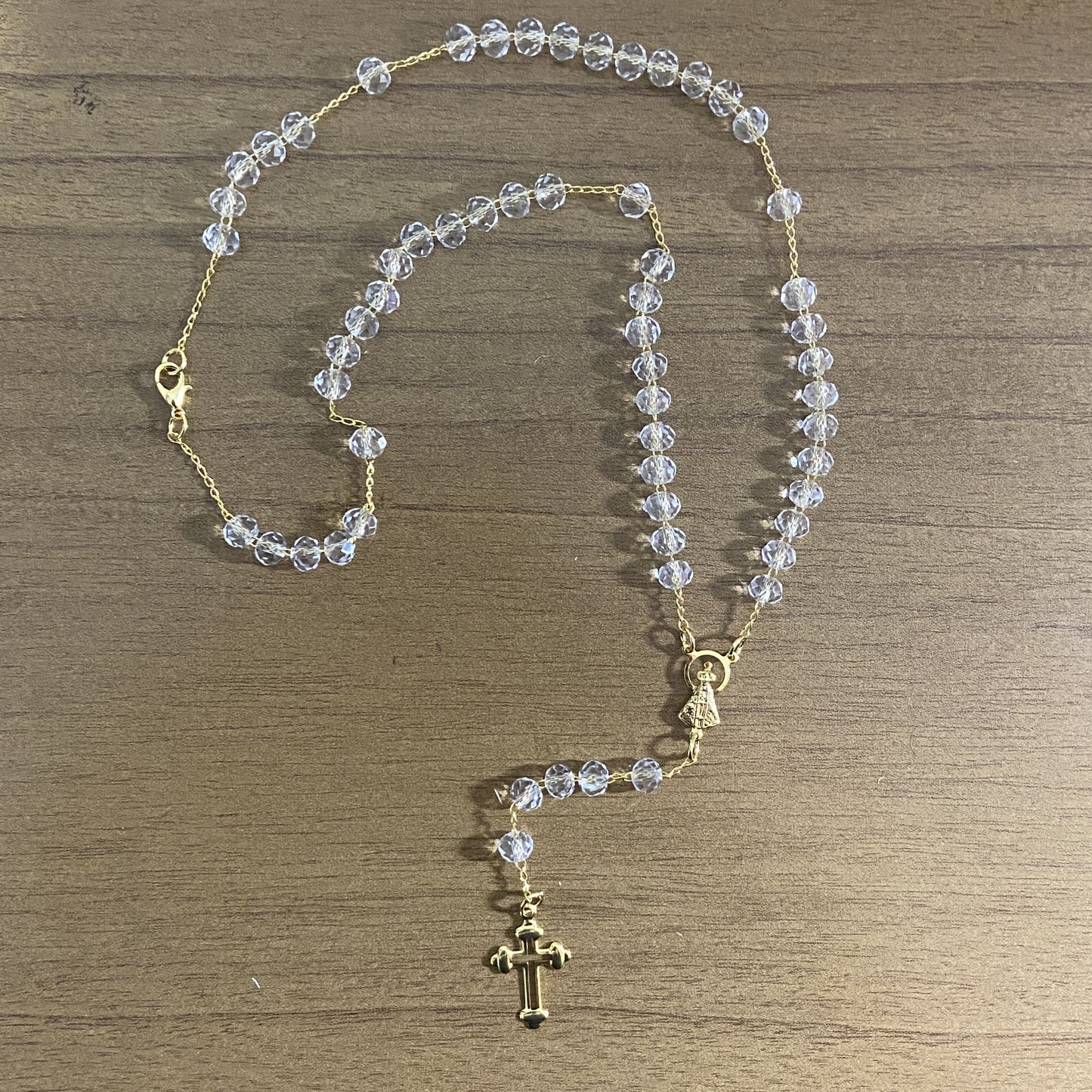 CORRENTE TERÇO CRISTAL NOSSA SENHORA APARECIDA TRANSPARENTE 04MM  (1 UNIDADE)
