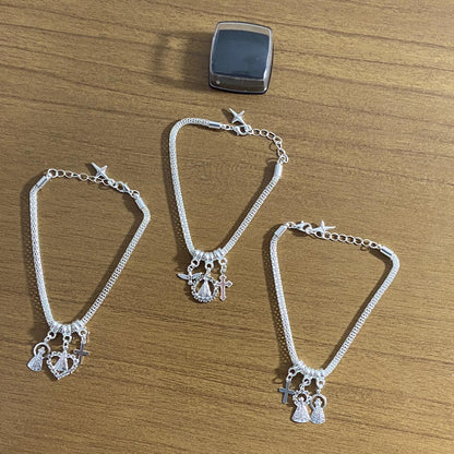 PULSEIRA PRATEADA NOSSA SENHORA APARECIDA MODELOS SORTIDOS COM STRASS (6 UNIDADES)