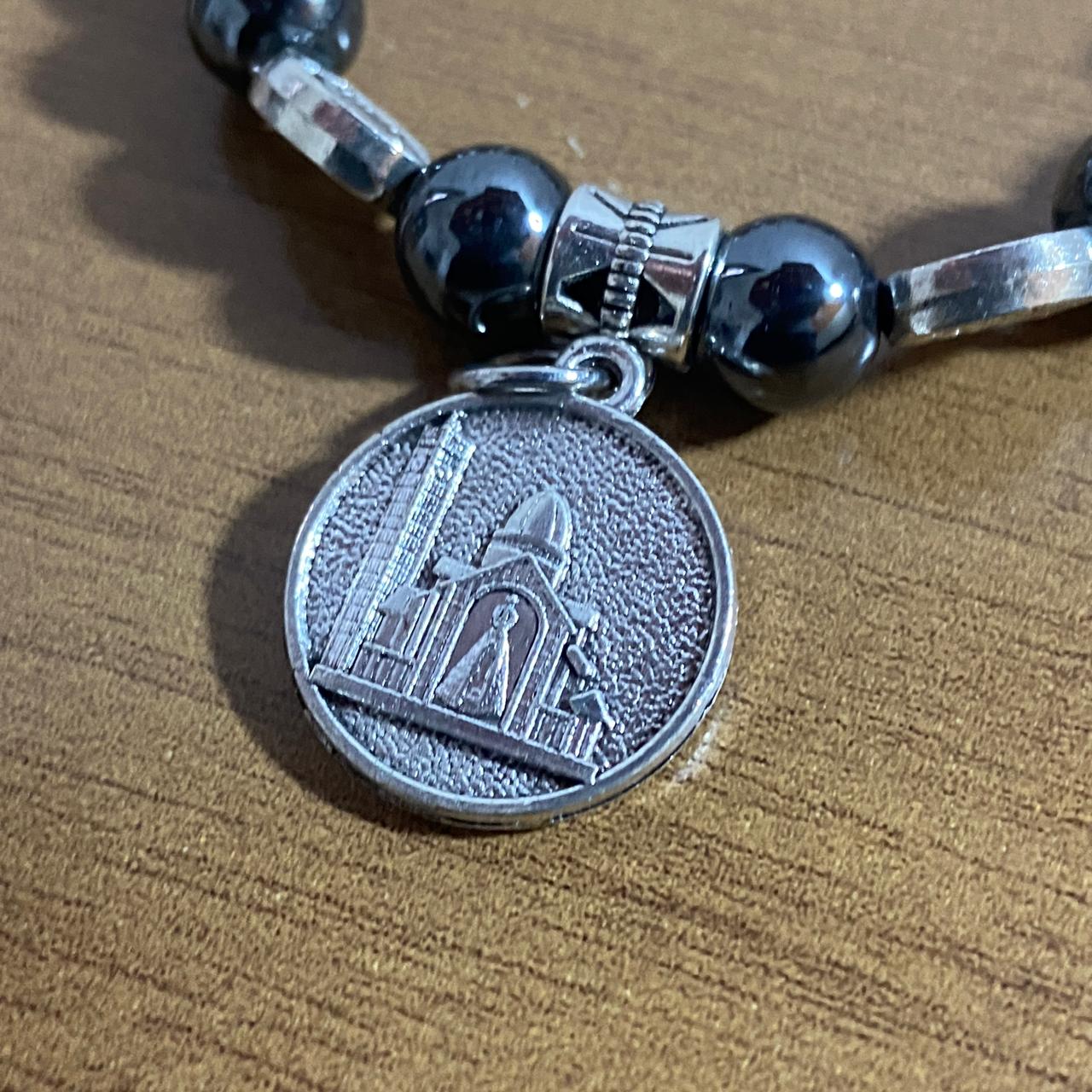 PULSEIRA HEMATITA NOSSA SENHORA APARECIDA MOD3 (12 UNIDADES)