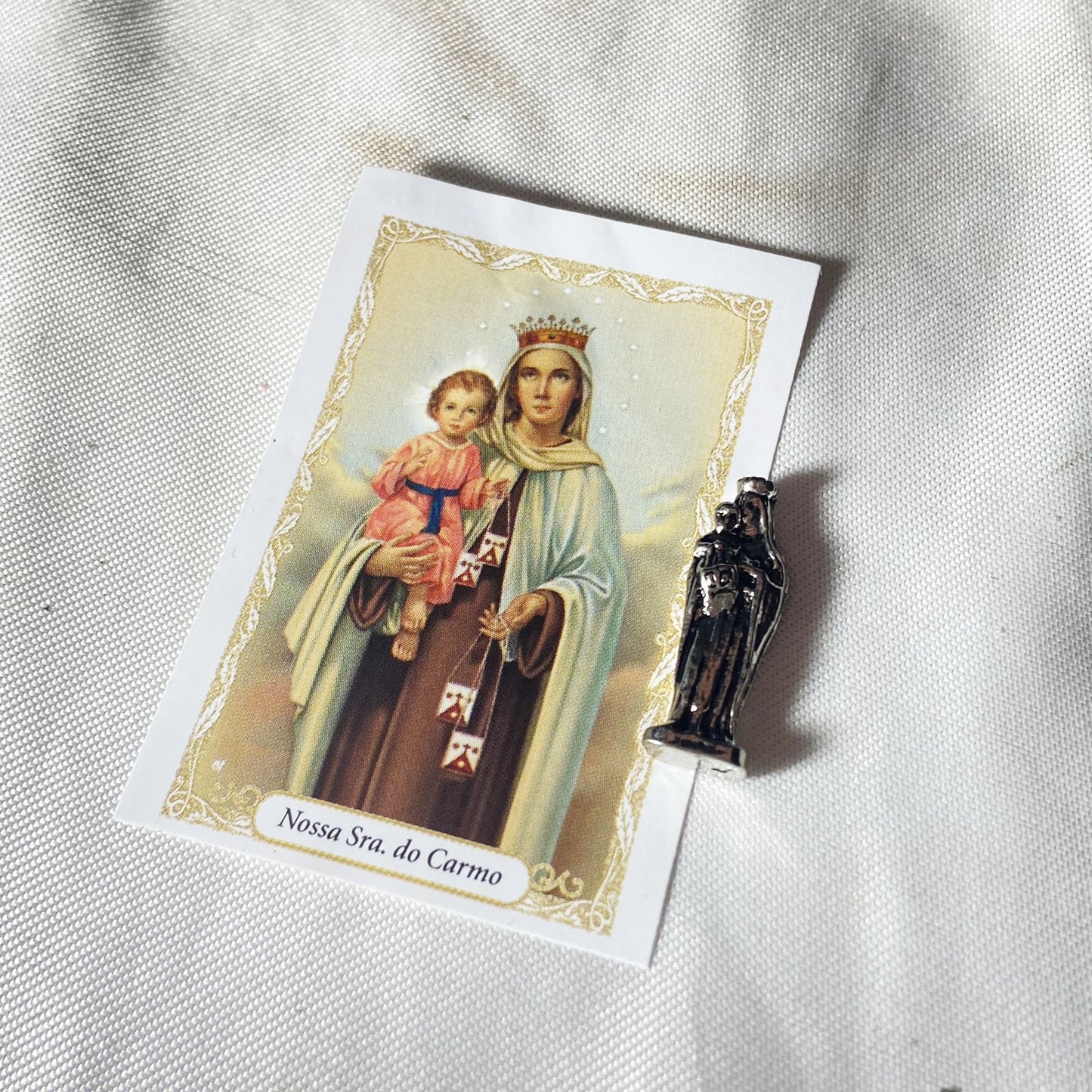 SANTO CHUMBO DE BOLSO NOSSA SENHORA DO CARMO (12 UNIDADES)