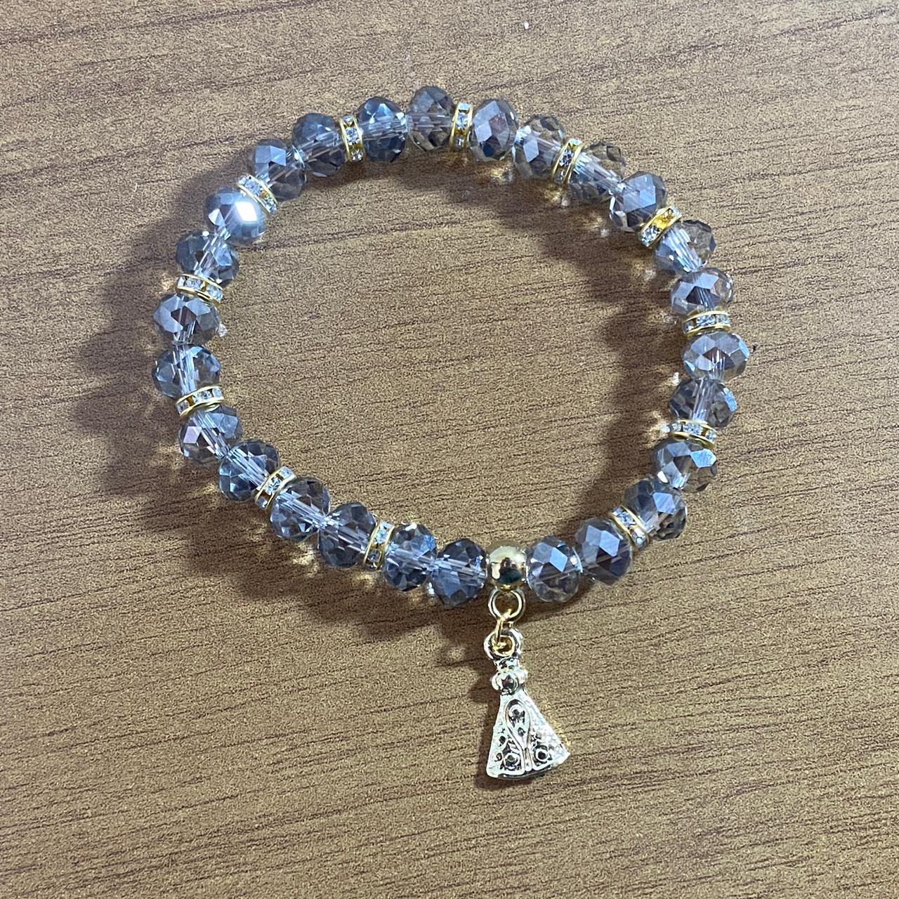 PULSEIRA CRISTAL CINZA TRANSPARENTE NOSSA SENHORA APARECIDA  (06 UNIDADES)