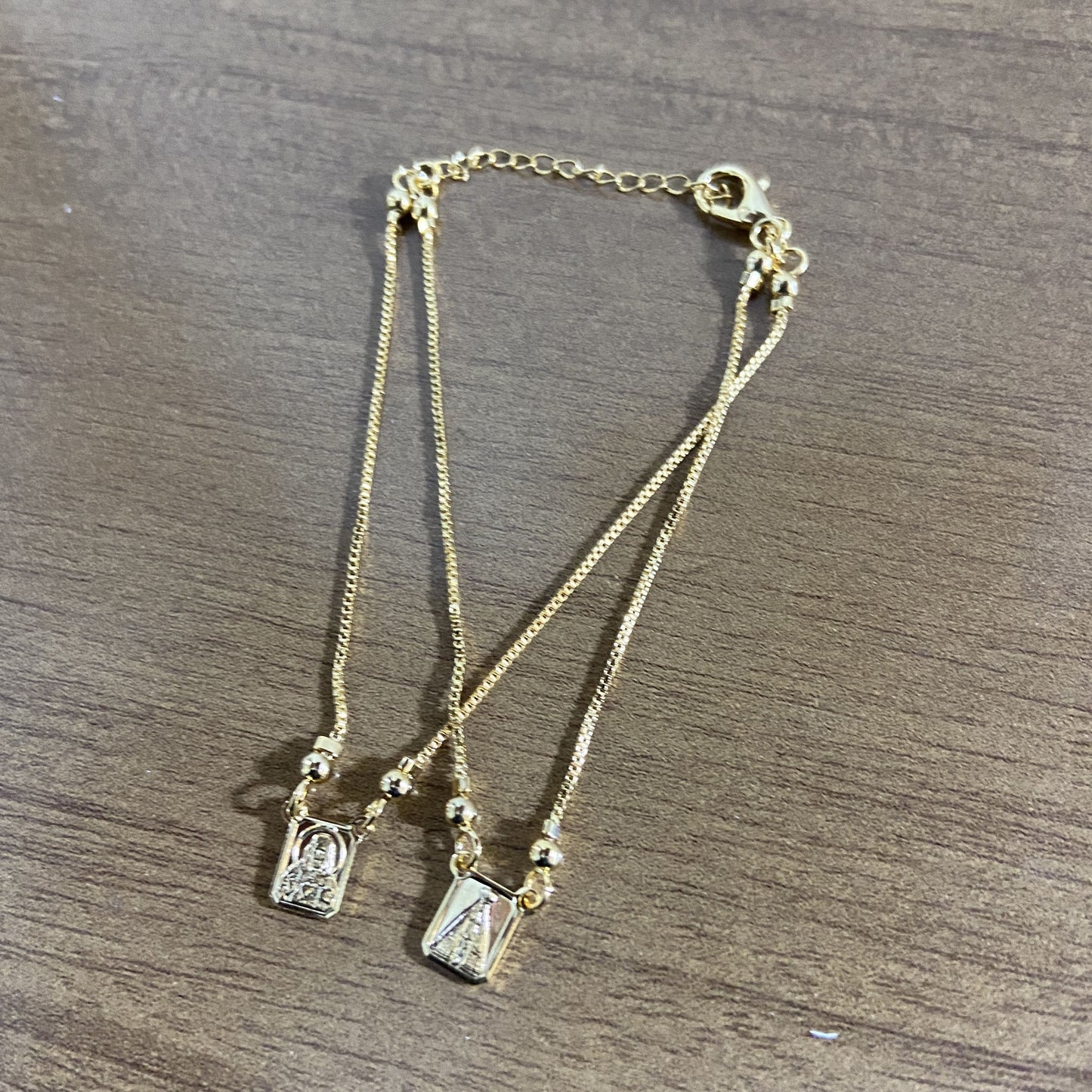 PULSEIRA ESCAPULARIO DOURADO SAGRADO CORAÇÃO DE JESUS E NOSSA SENHORA APARECIDA (3 UNIDADES)