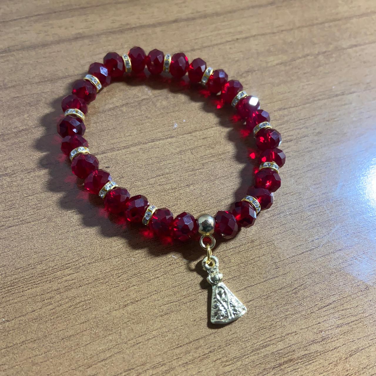 PULSEIRA CRISTAL VERMELHA TRANSPARENTE NOSSA SENHORA APARECIDA  (06 UNIDADES)