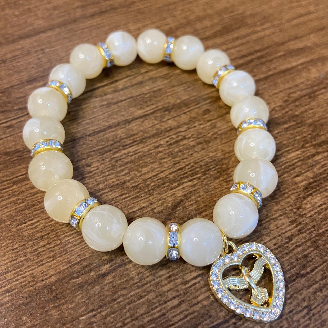 PULSEIRA PÉROLA BEGE COM PINGENTE DIVINO ESPÍRITO SANTO COM STRASS 08MM  (03 UNIDADES)
