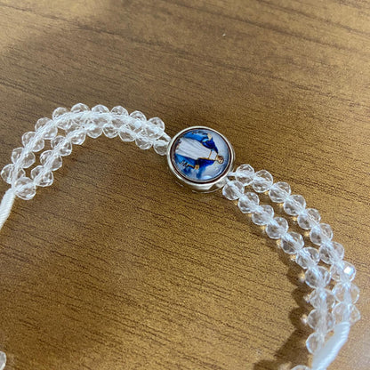 TERÇO PULSEIRA CRISTAL TRANSPARENTE COM MEDALHA RESINADA NOSSA SENHORA DAS GRAÇAS  (3 UNIDADES)