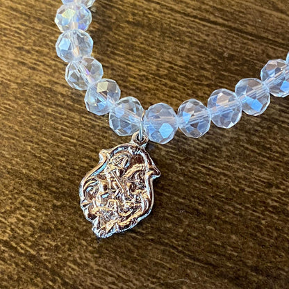 PULSEIRA CRISTAL COM MEDALHA PRATEADA SÃO JORGE (01 UNIDADE)