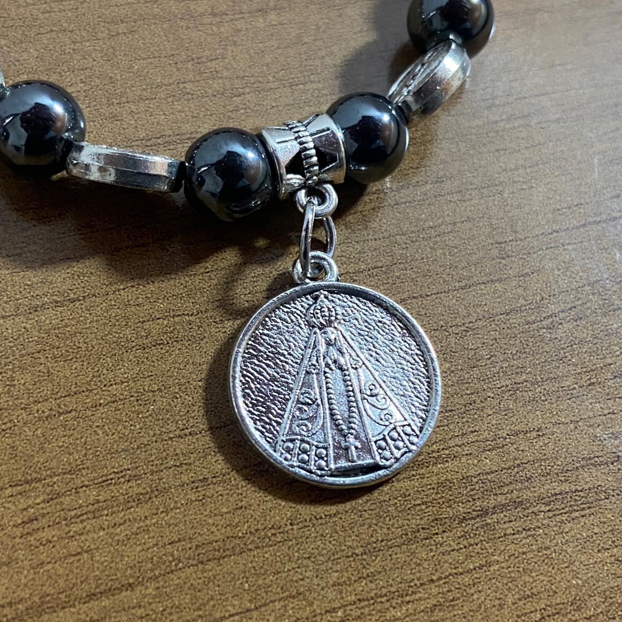 PULSEIRA HEMATITA NOSSA SENHORA APARECIDA MOD3 (12 UNIDADES)